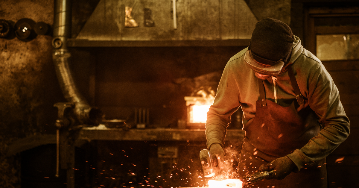 man is learning to blacksmith